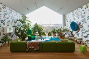Green sofa white blue living room patterened wallpaper Interior Design Blogs