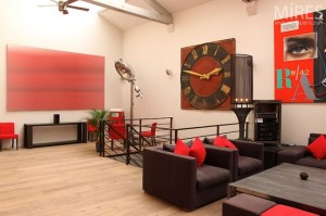 paris loft with red art and black furn Interior Design Blogs