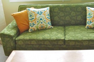 green couch with pillows 730x486 decor