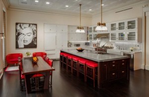 Excellent-Luxurious-Penthouse-With-Bright-Red-Accents-with-chandelier-kitchen-island-dining-table-chair-bar-stool-sofa-window-curtain-sink-cabinet