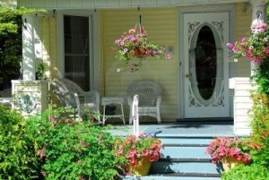 441587-house-porch-with-wicker-furniture-and-flowers