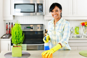 Woman cleaning kitchen1