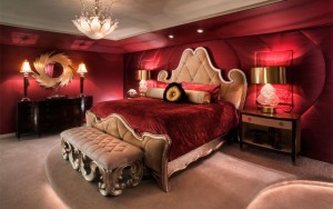 royal romantic style red maroon bedroom with light brown dark wood and gold color tone furnishings featuring king sized bed set with crown shaped tufted headboard and tufted end of bench bed brown w 984x6 Interior Design Blogs